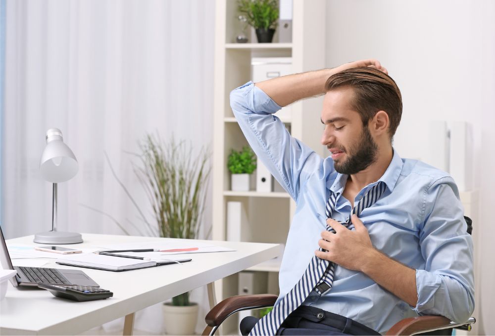 Man Experiencing Stress At Work