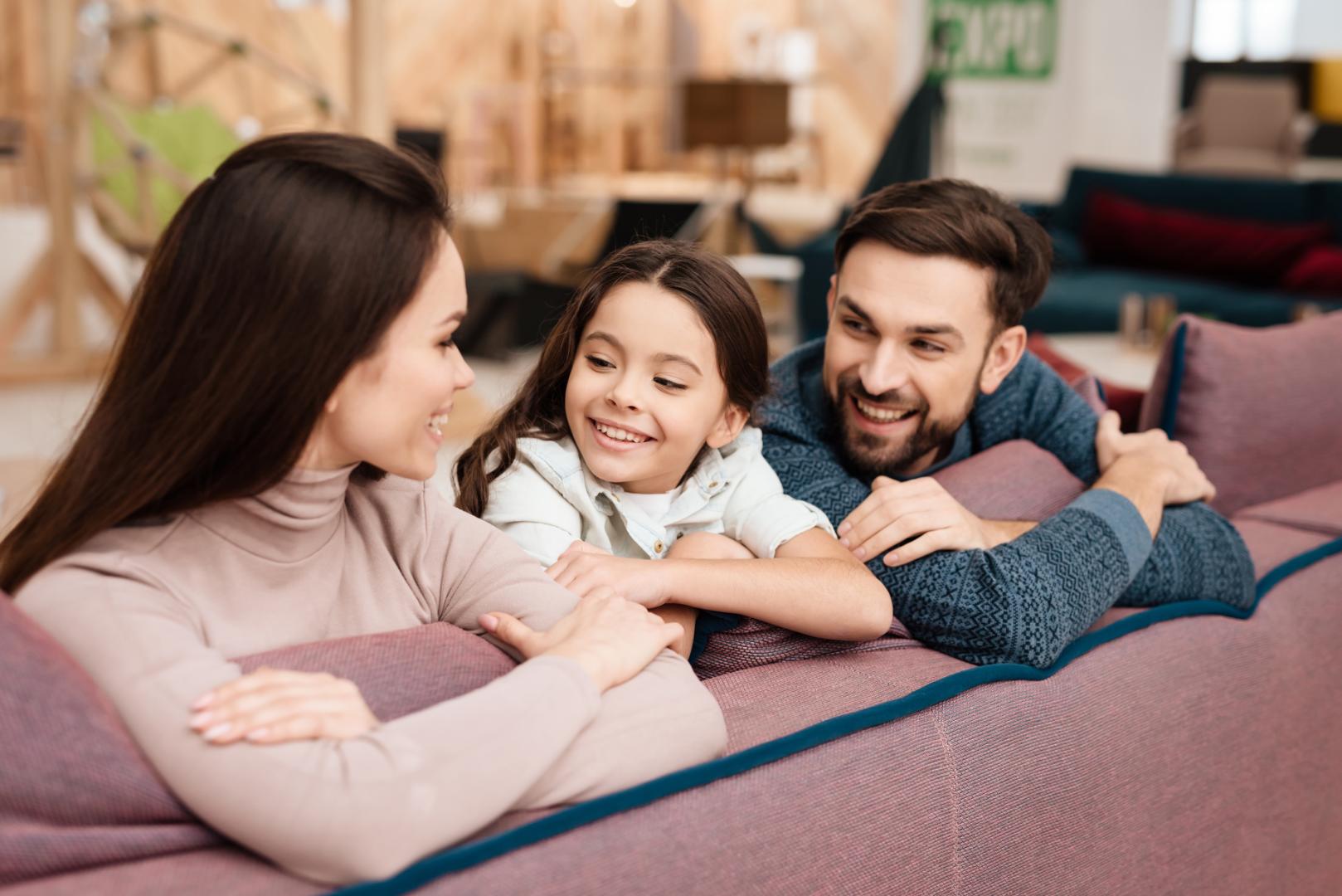 Happy Family Relaxing On Couch
